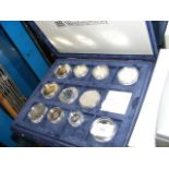 Twenty-four assorted proof silver coins, including