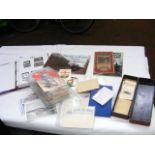 A box containing mixed vintage ephemera, including