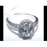 An 18ct white gold oval diamond ring - approx. 1.4