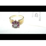 A diamond and ruby ring in 18ct gold setting