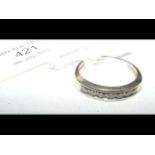 An 18ct gold seven stone diamond ring