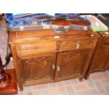 An 82cm wide oriental hardwood cupboard with two drawer