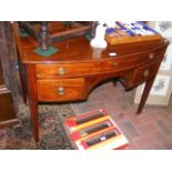 A 19th century mahogany bow front desk with three