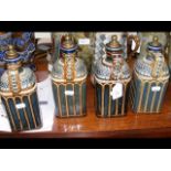 A set of four Doulton Lambeth stoneware decanters
