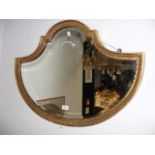 A decorative gilt mirror - 82cm
