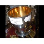 A silver tankard with London hallmark and gilt int