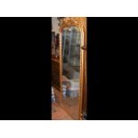 A decorative gilt framed hall mirror - 180cm x 65c