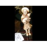 An antique Japanese ivory netsuke depicting a Dutchman h