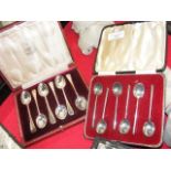 A set of six silver coffee spoons in presentation