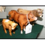 A Beswick cow ornament 'Dunsley', together with tw