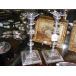 A fine pair of cast silver candlesticks - London 1