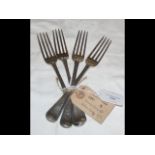 A set of four heavy silver dining forks - George I