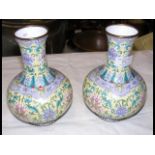 A pair of Chinese enamelled vases with foliate dec