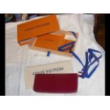 A Louis Vuitton Clemence purple wallet purse with
