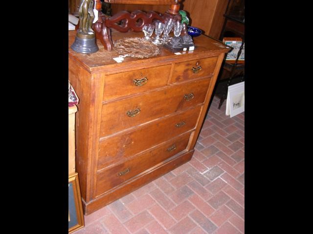 An antique chest of drawers