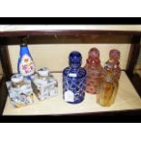 Assorted overlay glass bottles and stoppers, orien