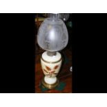 A blush ivory ceramic oil lamp with thistle decora