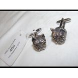 A pair of solid silver French bulldog cufflinks wi