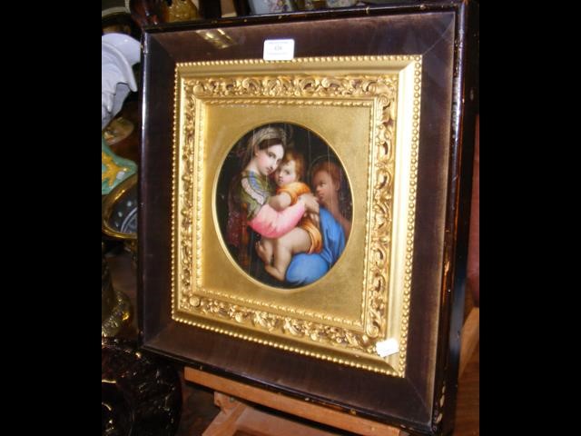 An 18cm diameter antique painting of Madonna and child