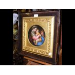 An 18cm diameter antique painting of Madonna and child