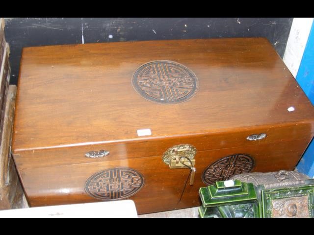 An oriental carved camphor wood chest - W100cm