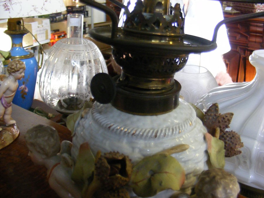 Three oil lamps with reservoirs in the form of bas - Image 2 of 14