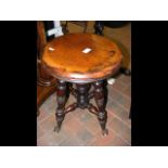 An antique revolving piano stool