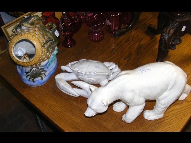 A ceramic figure of a polar bear, together with lo