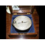 An oak glazed compensated aneroid barometer by Sta