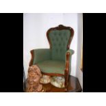 A Victorian style button back armchair