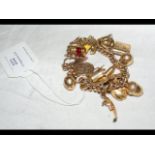 A 9ct gold charm bracelet - approx weight 36g