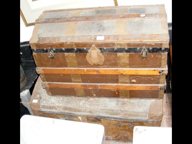 An antique domed top trunk, together with one othe