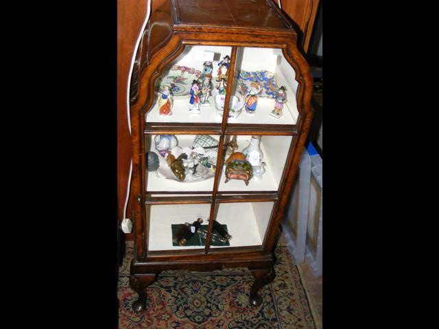 A small Queen Anne style walnut display cabinet on