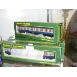 Five boxed replica railway carriages