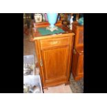 An Edwardian inlaid mahogany pot cupboard enclosed