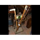 An antique stick/umbrella stand, together with fou