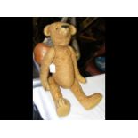 An antique Strawfield teddy bear having Steiff but