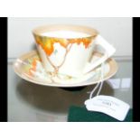 A Clarice Cliff Bizarre pattern cup and saucer dec