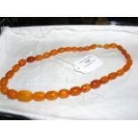 An amber bead necklace - approx weight 35g