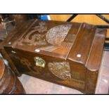 A carved oriental camphor wood box - W100cm