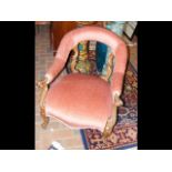 A Victorian carved mahogany easy armchair with uph