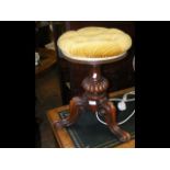 A Victorian revolving piano stool