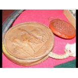 An antique circular wax seal in leather case - dia
