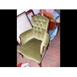 An Edwardian armchair with button back