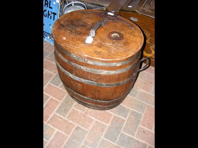 An old two handled metal bound barrel with lid