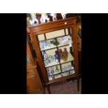 An Edwardian inlaid mahogany display cabinet on sq