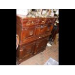 An unusual antique walnut chest of drawers with ge