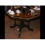 A 19th century walnut and ebonized octagonal table