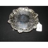 A silver salver with shell and scroll design, mark