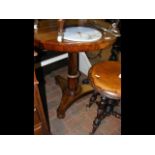 A 19th century circular rosewood wine table - dia